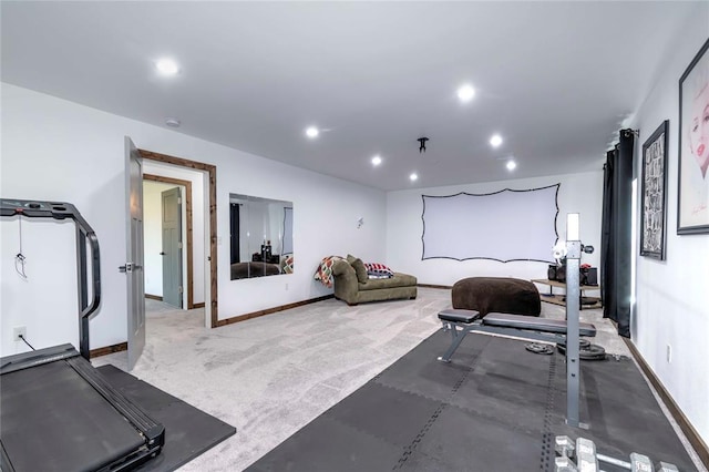 exercise room featuring light colored carpet