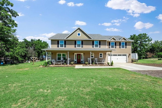 view of front of property featuring covered porch, a garage, and a front yard