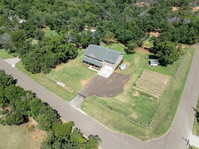 birds eye view of property with a rural view