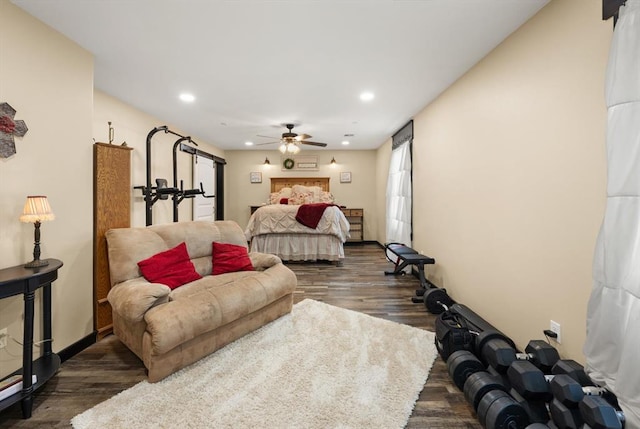 bedroom featuring ceiling fan and dark hardwood / wood-style floors