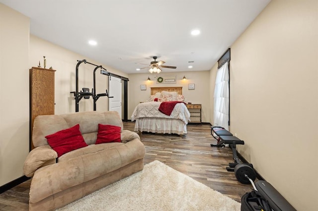 bedroom featuring ceiling fan and dark wood-type flooring