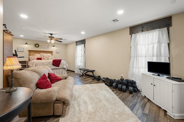 bedroom featuring dark hardwood / wood-style floors and ceiling fan