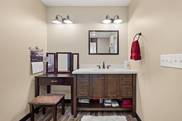 bathroom featuring hardwood / wood-style floors and vanity