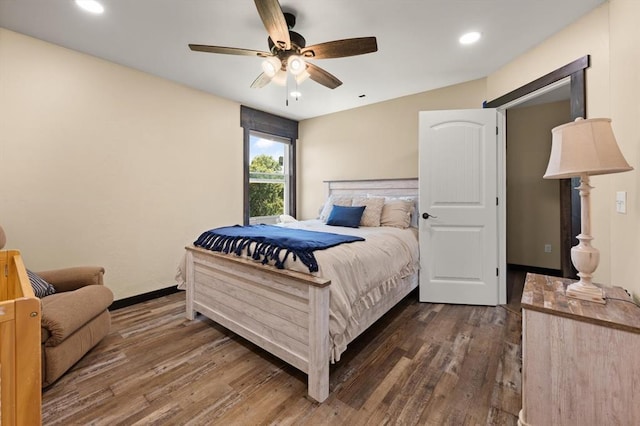 bedroom featuring ceiling fan and dark wood-type flooring