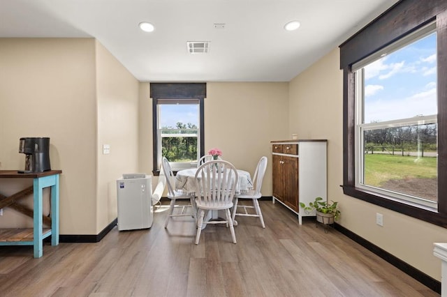 dining room featuring light hardwood / wood-style flooring