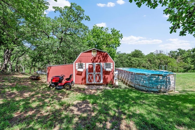 view of outbuilding featuring a lawn