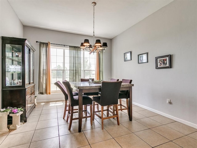 tiled dining area with an inviting chandelier