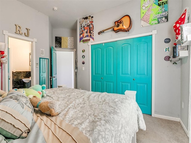 bedroom featuring connected bathroom, a closet, and carpet