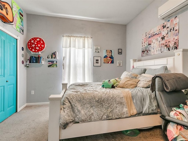 bedroom with light carpet, an AC wall unit, and a closet