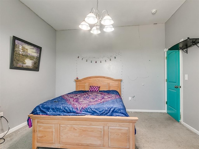 carpeted bedroom featuring an inviting chandelier