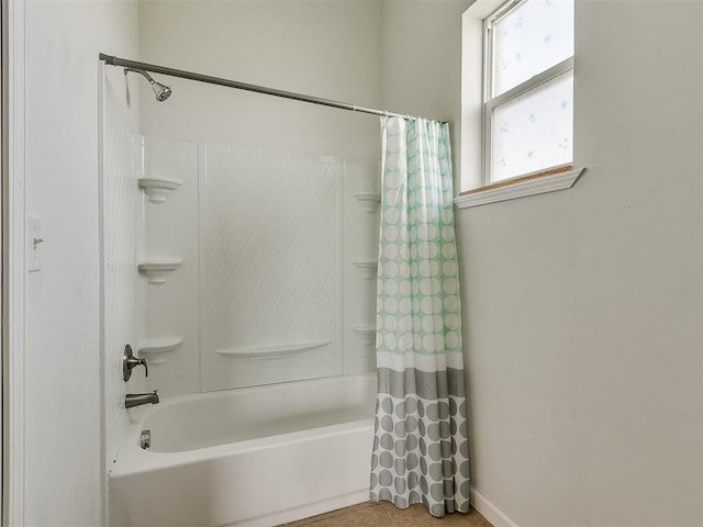 bathroom with shower / bathtub combination with curtain