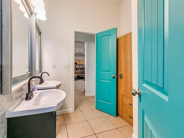 bathroom with tile patterned floors and vanity