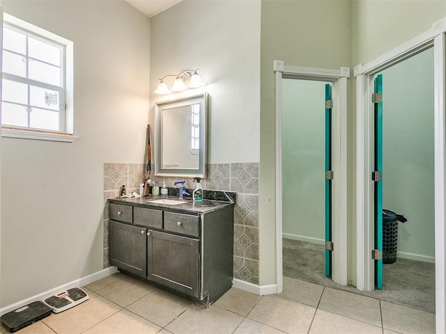 bathroom with tile patterned floors and vanity