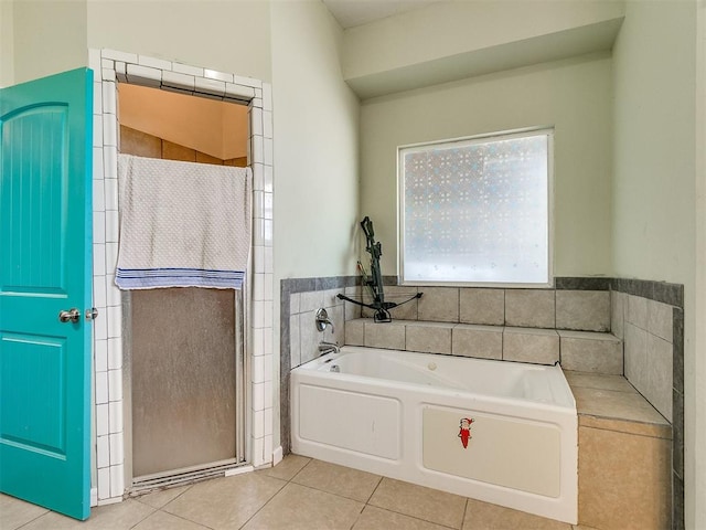 bathroom featuring a bathing tub and tile patterned flooring