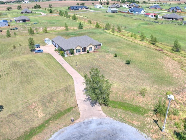 birds eye view of property featuring a rural view