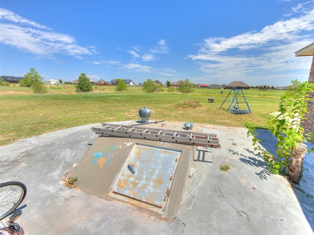 entry to storm shelter featuring a lawn