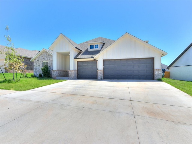 view of front of house with a front yard and a garage