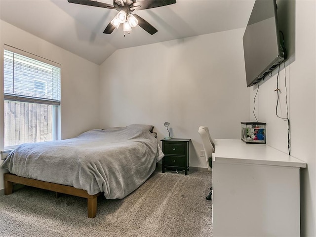 carpeted bedroom with ceiling fan and lofted ceiling