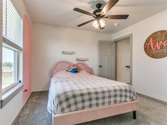 carpeted bedroom with ceiling fan