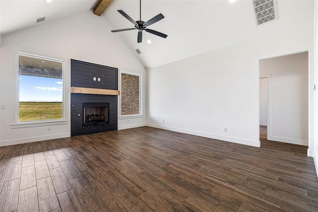 unfurnished living room with visible vents, high vaulted ceiling, dark wood-style flooring, and a fireplace