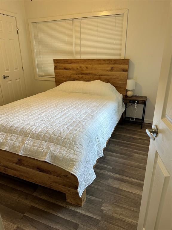 bedroom featuring dark hardwood / wood-style floors