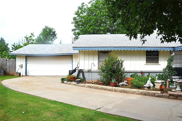 5932 NW 62nd Ter, Oklahoma City, OK 73122 - ranch-style house featuring board and batten siding, concrete driveway, and an attached garage