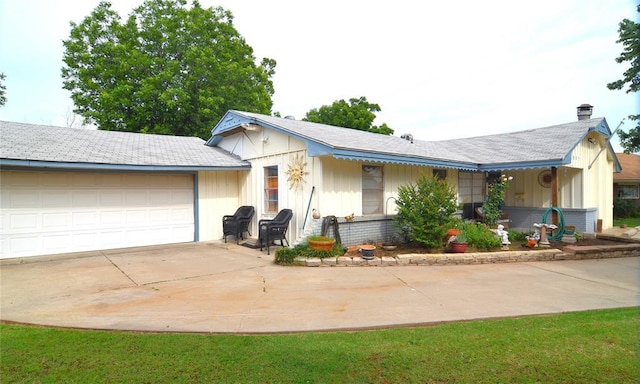 5932 NW 62nd Ter, Oklahoma City, OK 73122 - ranch-style house featuring concrete driveway, an attached garage, and a chimney