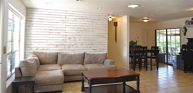 5932 NW 62nd Ter, Oklahoma City, OK 73122 - living area featuring a textured ceiling and light tile patterned flooring