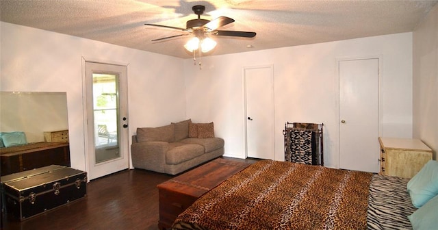 5932 NW 62nd Ter, Oklahoma City, OK 73122 - bedroom with a textured ceiling, wood finished floors, and a ceiling fan