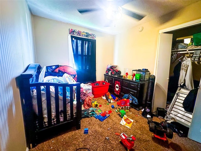 carpeted bedroom featuring a closet and ceiling fan