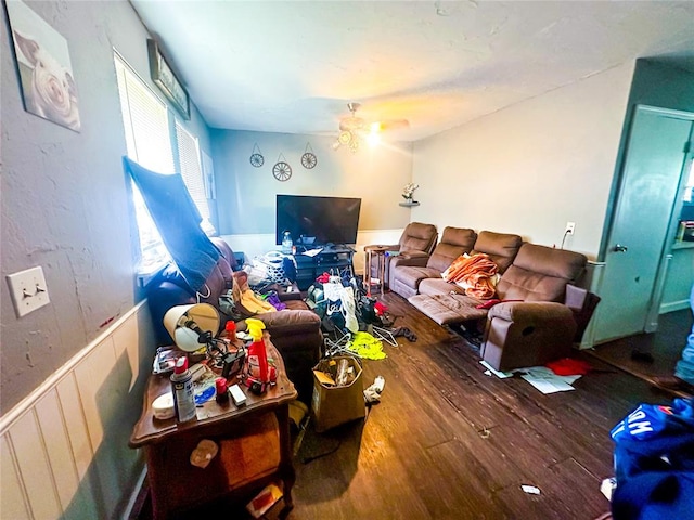 living room with wood-type flooring and ceiling fan