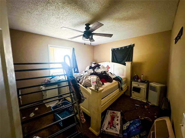 bedroom featuring a textured ceiling and ceiling fan