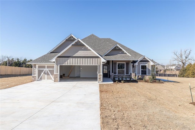 craftsman-style home featuring covered porch and a garage