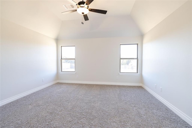 spare room with lofted ceiling, carpet floors, and ceiling fan