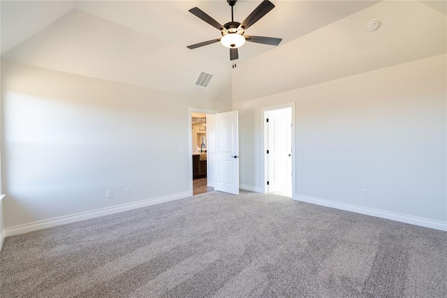 unfurnished bedroom with ceiling fan, lofted ceiling, and carpet