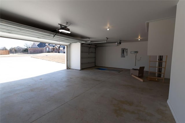 garage with electric panel and a garage door opener