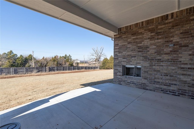 view of patio / terrace featuring an outdoor brick fireplace