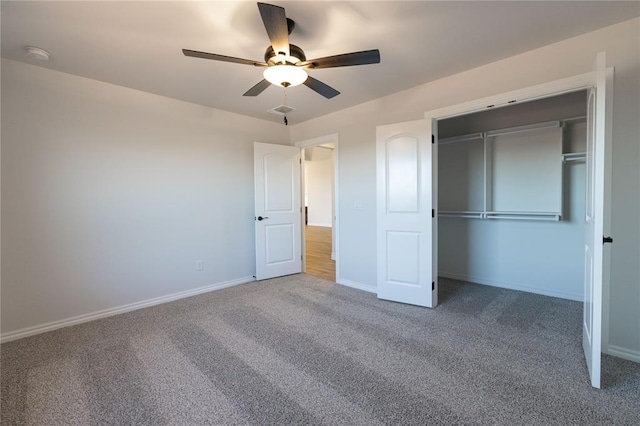 unfurnished bedroom featuring a closet, ceiling fan, and carpet