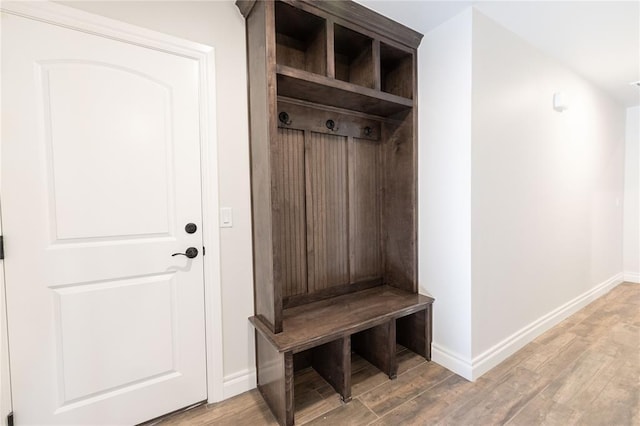 mudroom with wood-type flooring