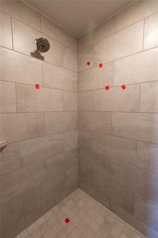 bathroom with tiled shower