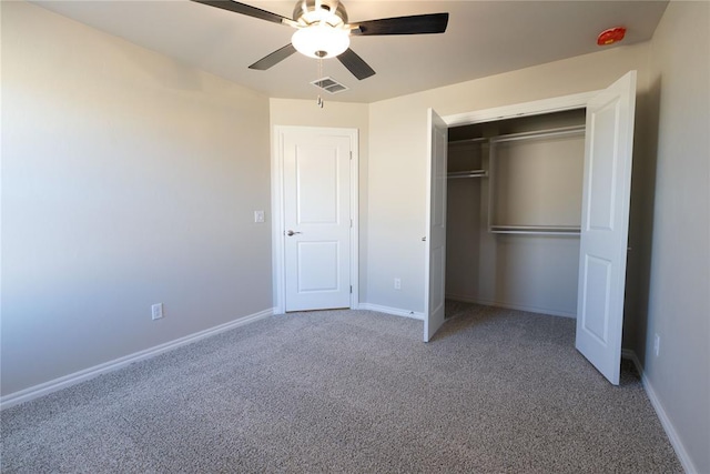 unfurnished bedroom with a closet, ceiling fan, and carpet floors