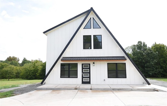 view of front of home featuring metal roof and board and batten siding