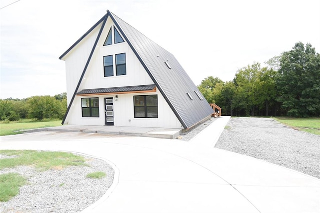 view of front facade with a standing seam roof and metal roof