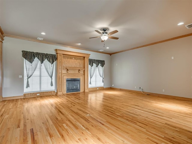 unfurnished living room featuring ceiling fan, light hardwood / wood-style floors, and ornamental molding