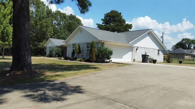 view of property exterior featuring a yard and a garage