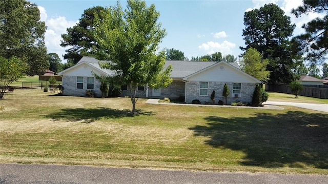 ranch-style house with a front yard