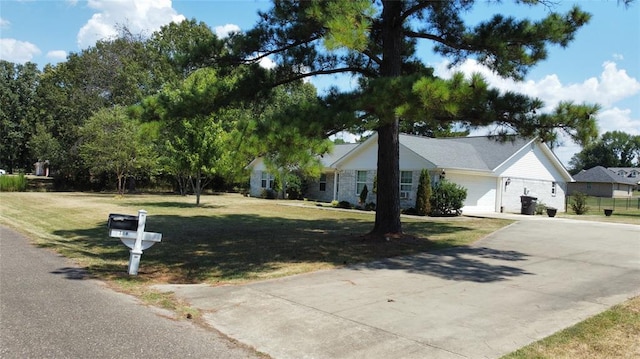 single story home featuring a front yard and a garage