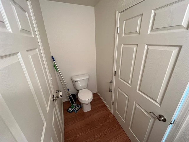 208 N Kay Dr, Broken Bow, OK 74728 - bathroom with wood finished floors, toilet, and baseboards