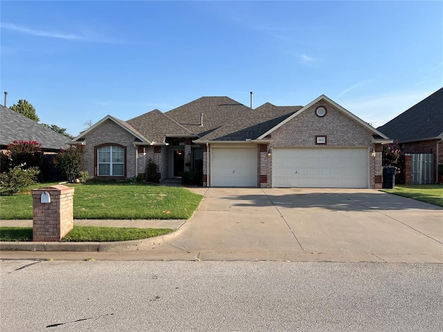 ranch-style house featuring a front yard and a garage