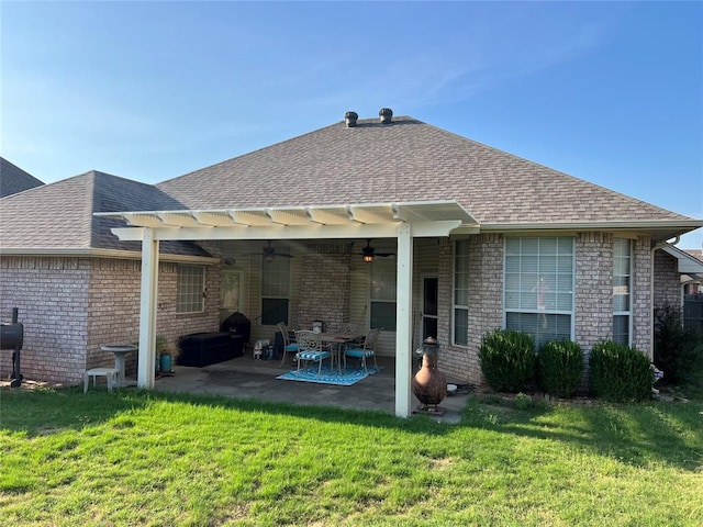 rear view of house with a pergola, a patio, ceiling fan, and a lawn